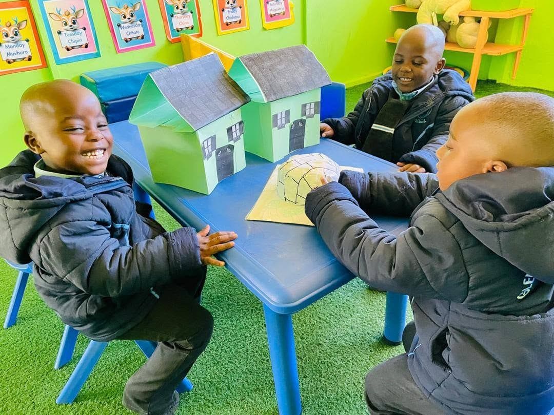 Learners working together on a craft project