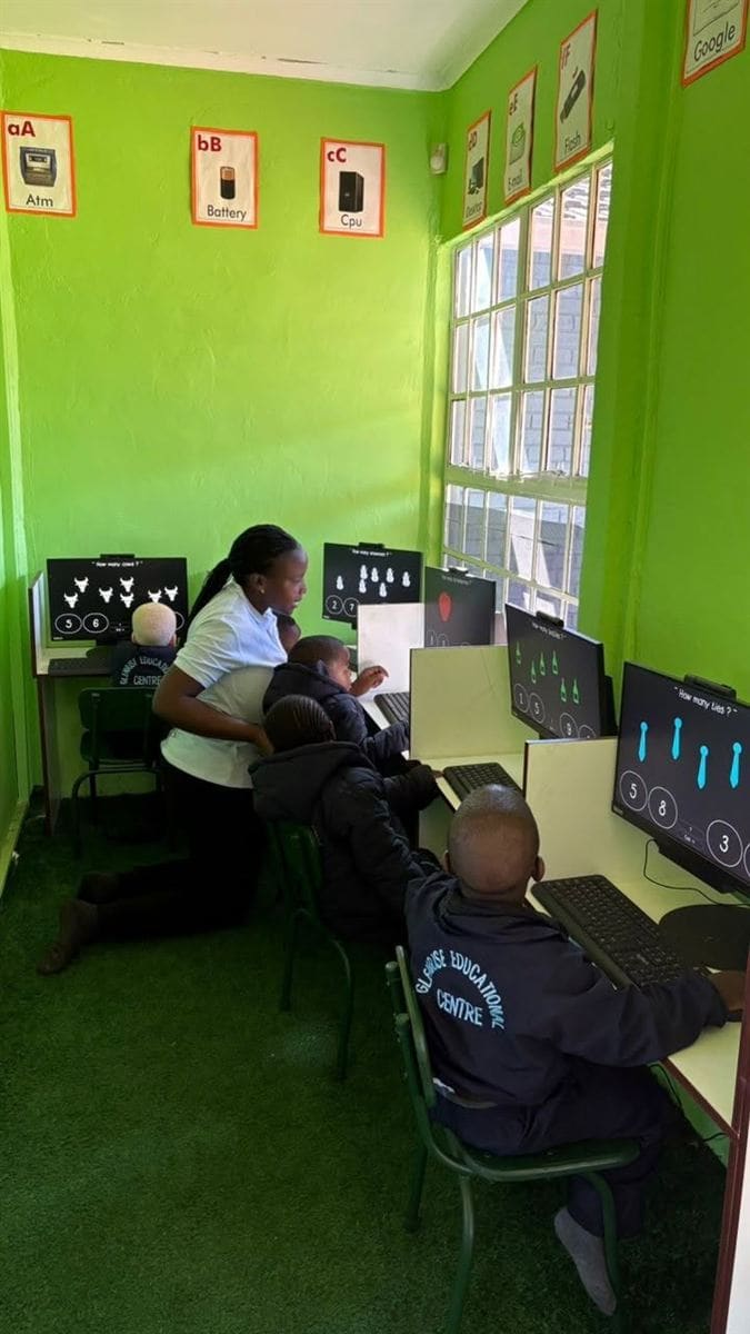 ICT lab session with a teacher and learners